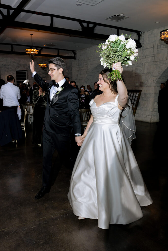 newlyweds arriving at their wedding reception