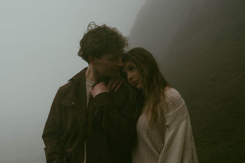 fiance kissing his fiance on the forehead