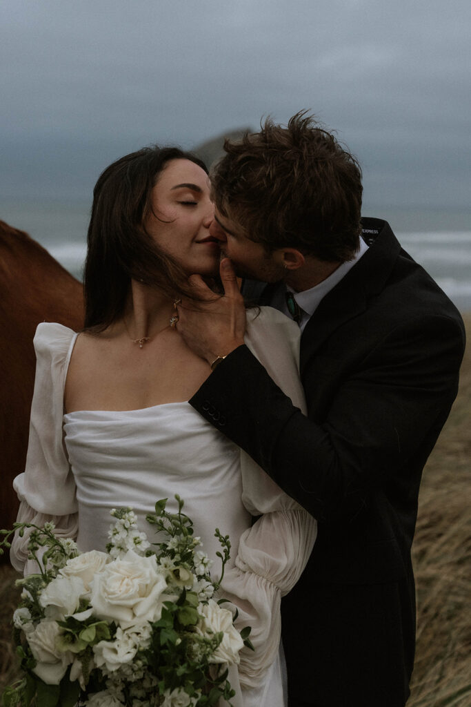cute picture of the bride and groom kissing