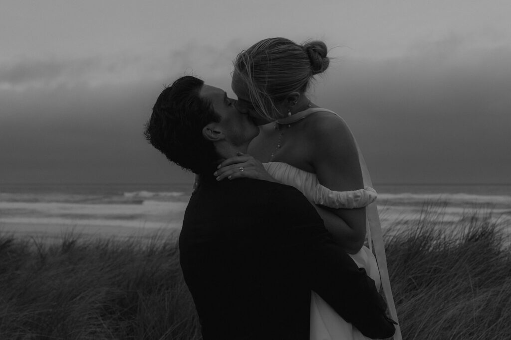 portrait of the bride and groom kissing
