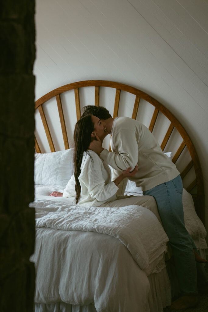 groom kissing the bride on the cheek