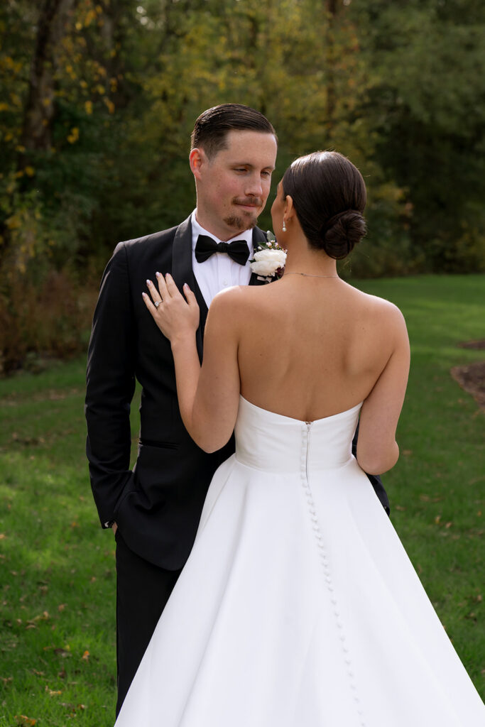 cute picture of the bride and groom smiling at each other