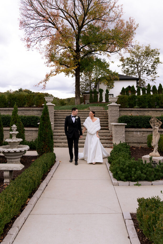 cute picture of the bride and groom holding hands