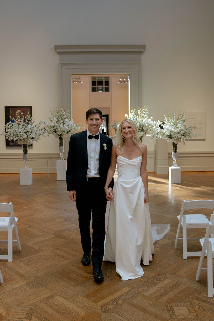 couple smiling at the camera during their photoshoot