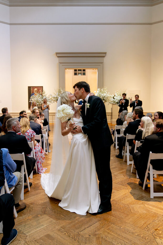 bride and groom kissing after their ceremony