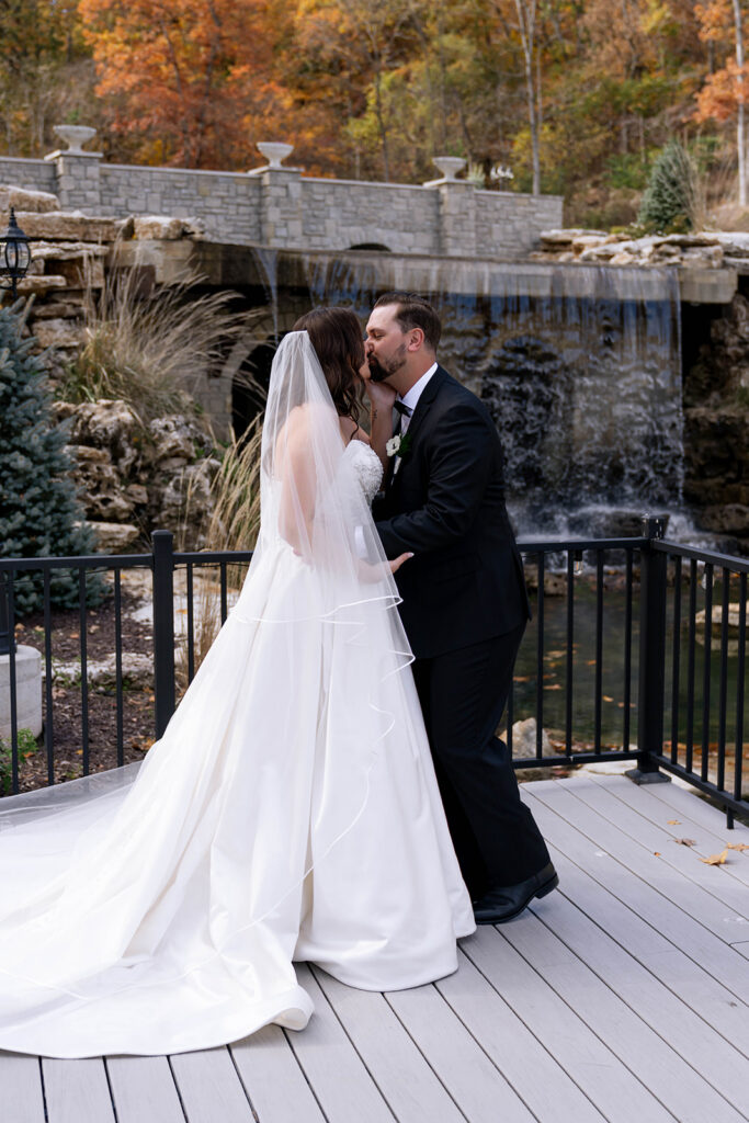 cute picture of the bride and groom kissing