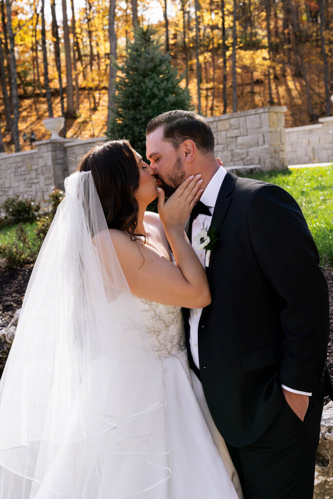 cute picture of the bride and groom kissing
