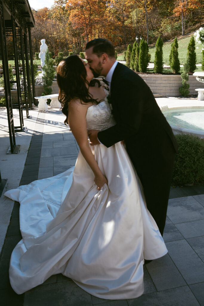 cute picture of the bride and groom kissing