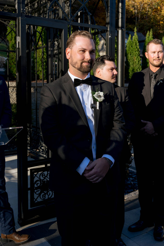 groom emotional watching the bride walk down the aisle