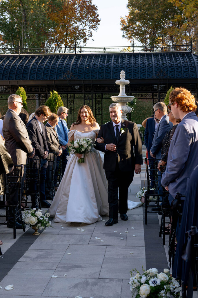 cute portrait of the bride walking down the aisle