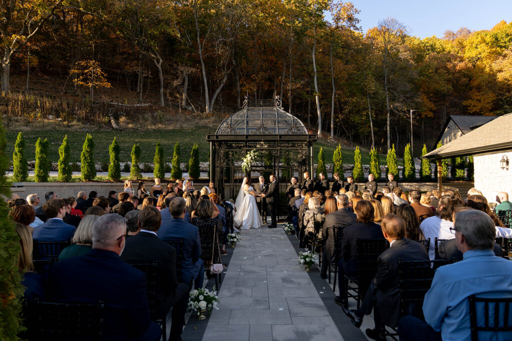 bride and groom holding hands during their wedding ceremony