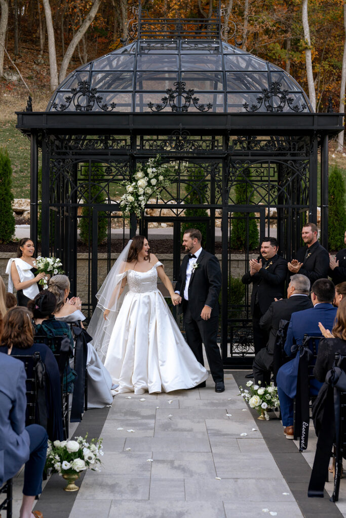 newlyweds heading to their wedding reception