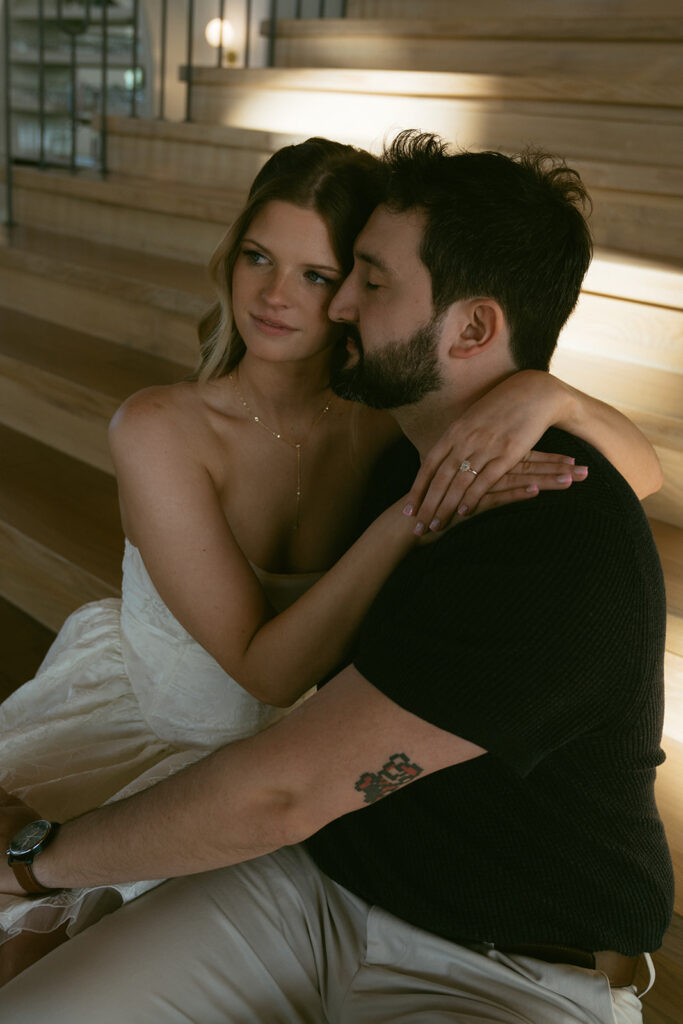 fiance kissing his fiance on the cheek