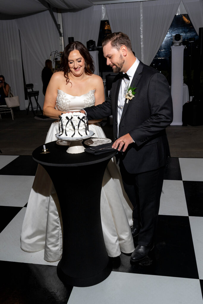 newlyweds cutting their wedding cake