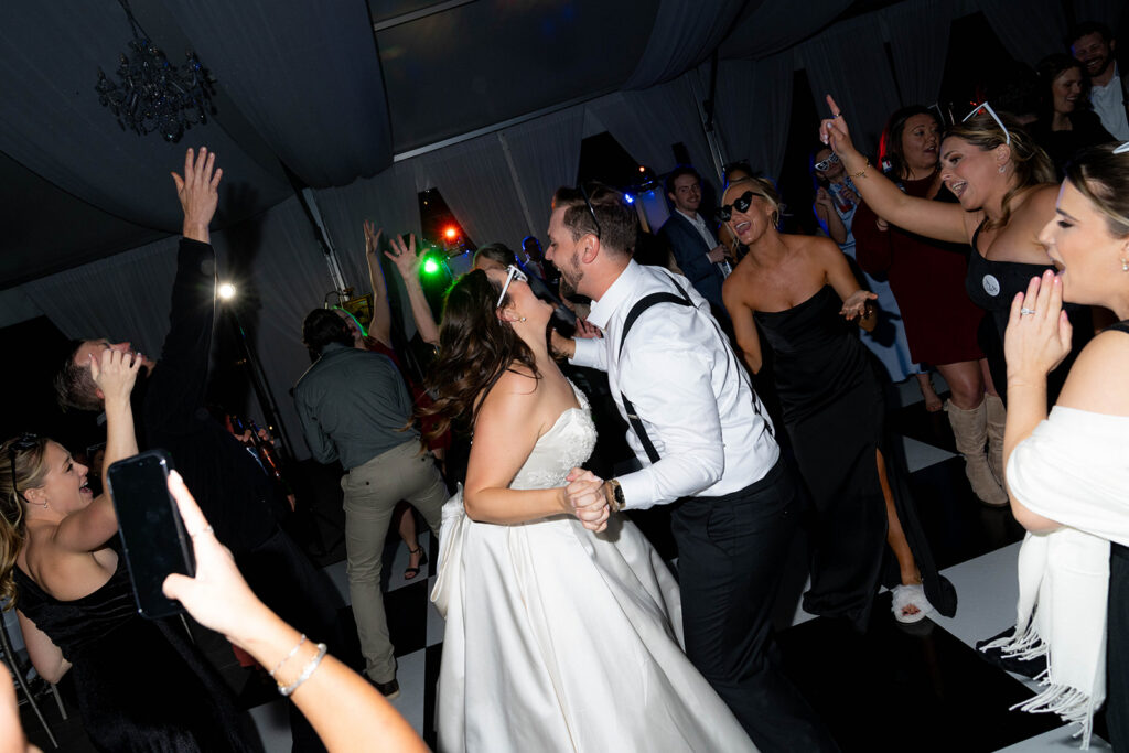 newlyweds having the best time at the wedding reception