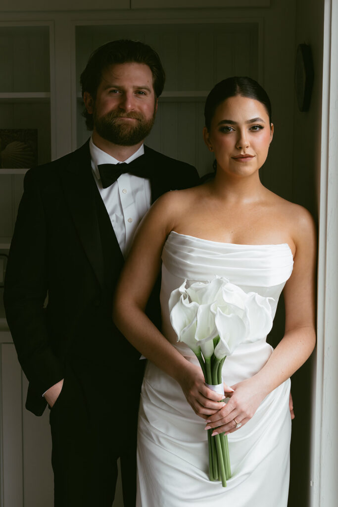 Bride and groom, smiling at the camera during their bridal portraits
