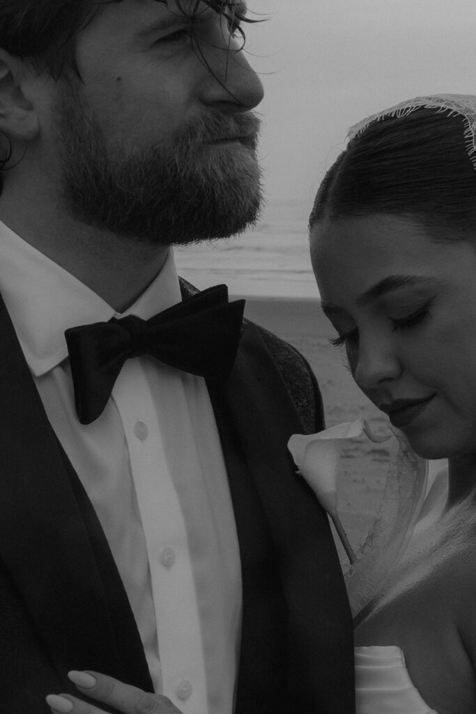 groom kissing the groom on the forehead