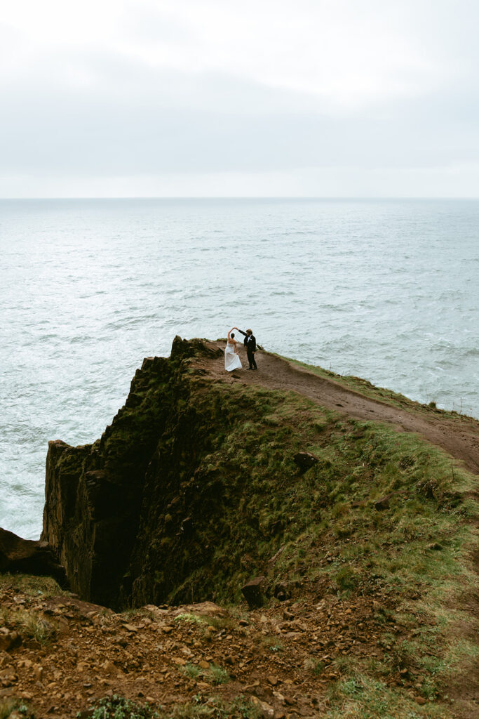 cute picture of the bride and groom dancing during their bridal portraits