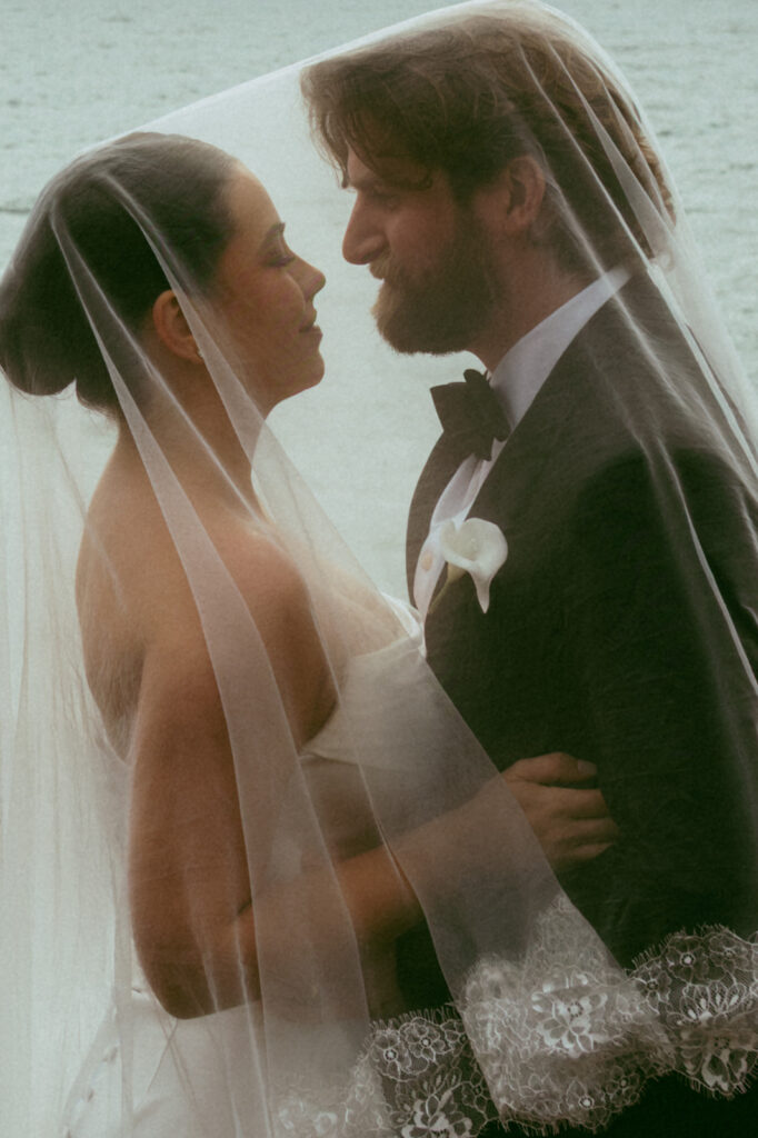 cute picture of the bride and groom laughing with each other during their photoshoot