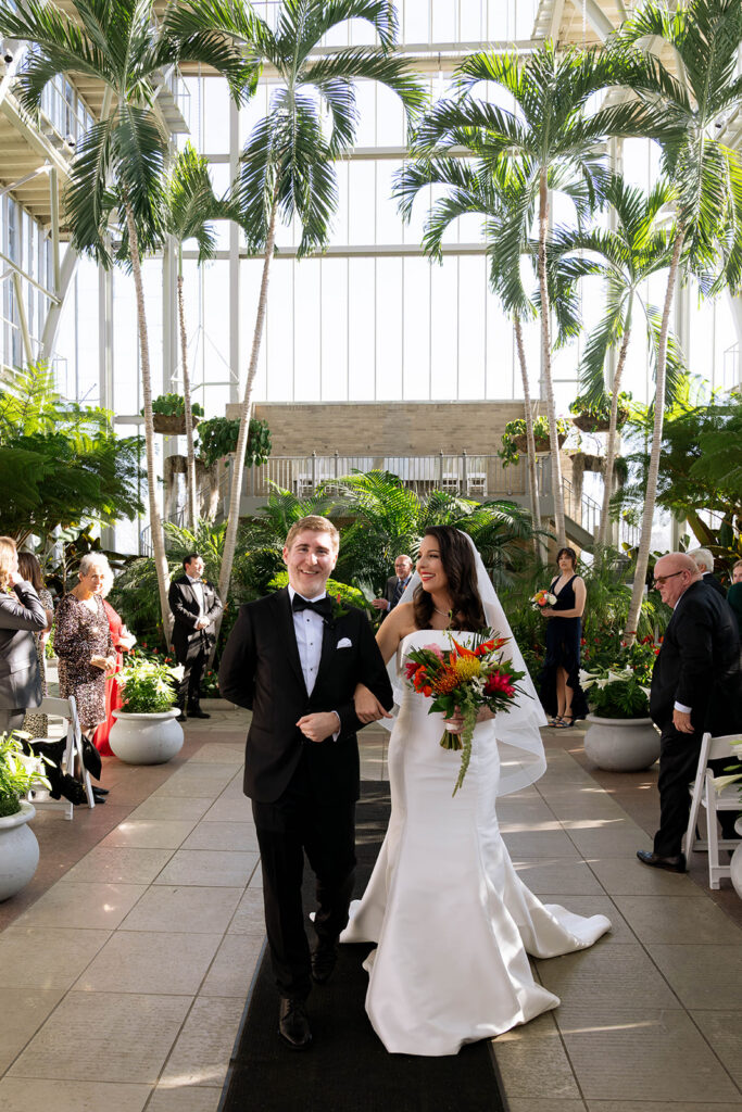 newlyweds heading to their wedding reception