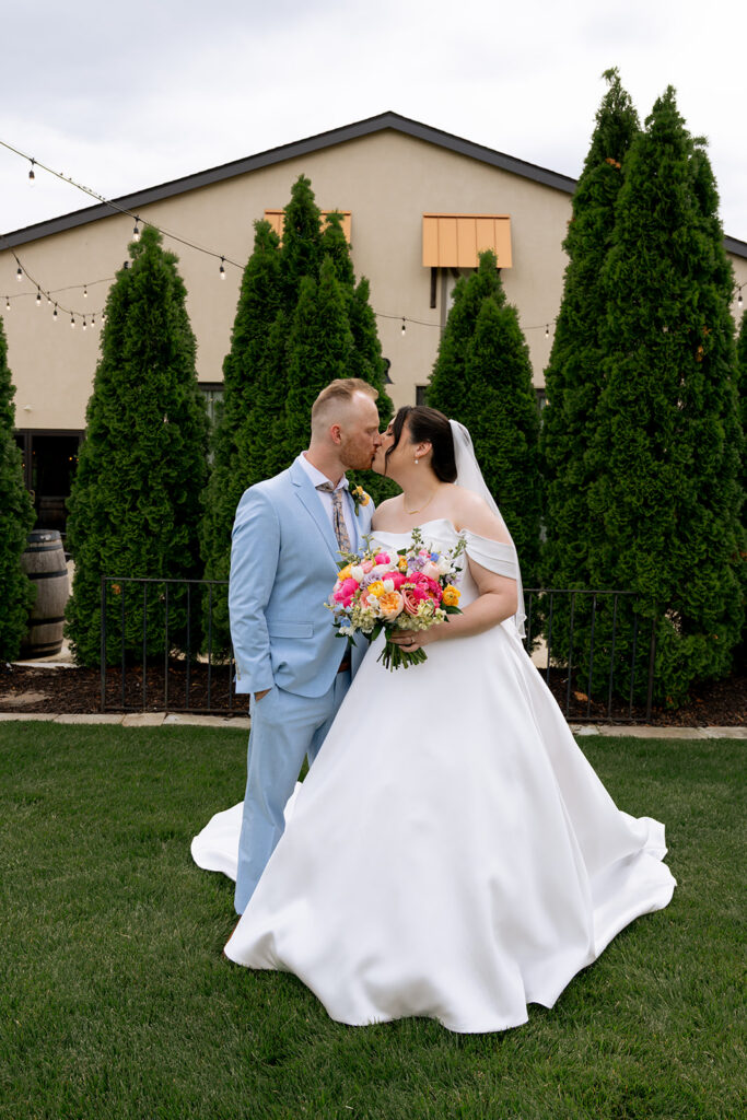 cute picture of the bride and groom kissing