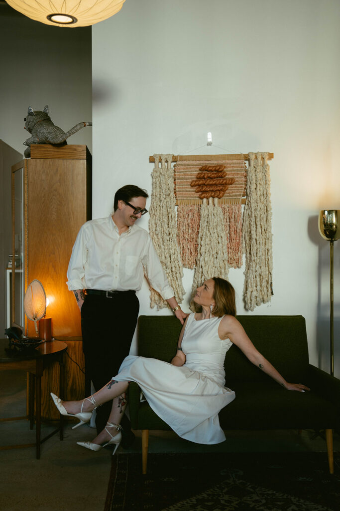 Newly engaged couple smiling at each other during their photo shoot