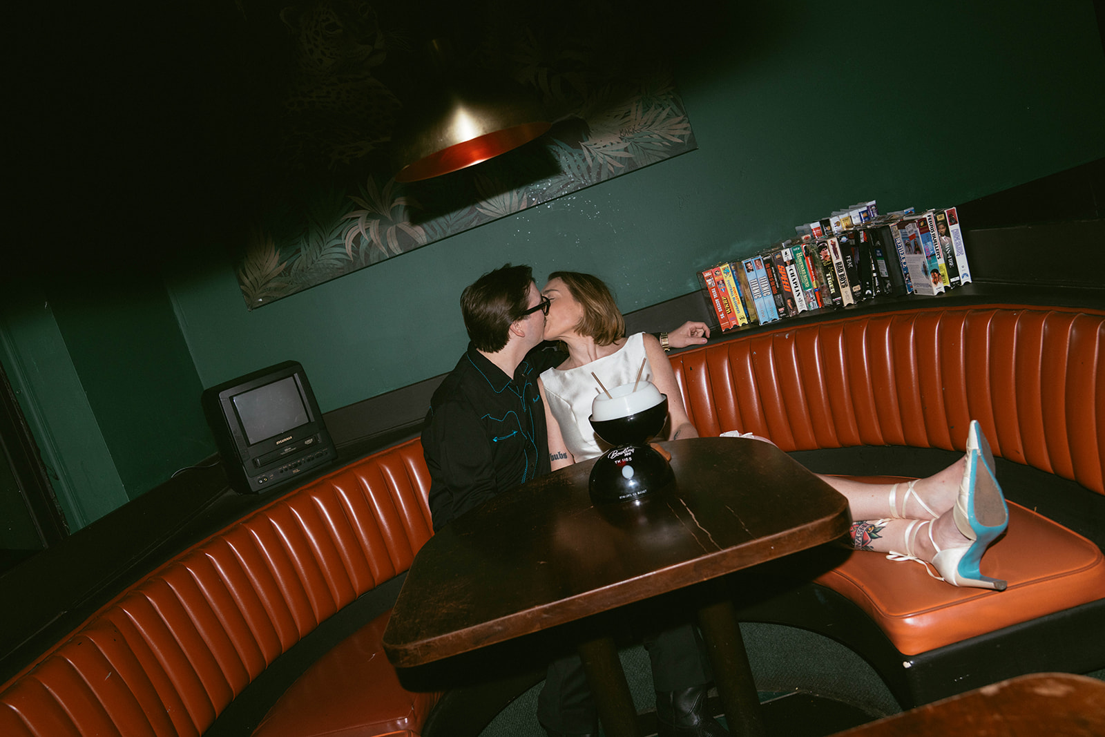 Cute portrait of the newly engaged, couple kissing