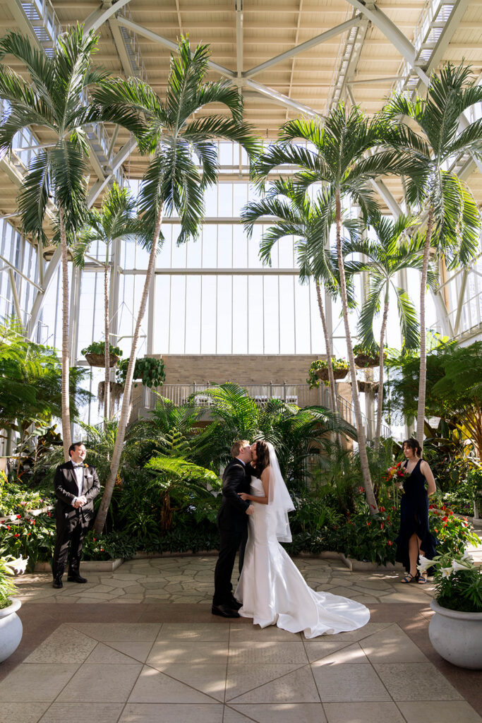 newlyweds kissing after their ceremony