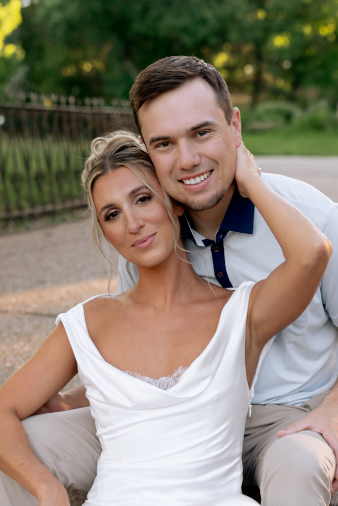 couple smiling at the camera during their romantic portraits