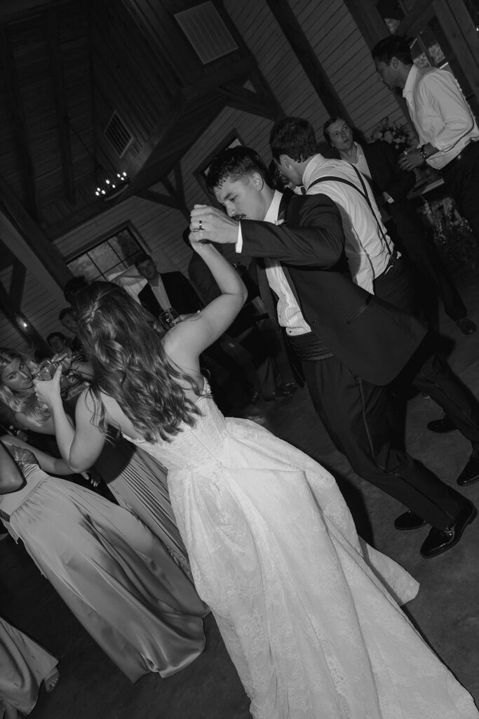 newlyweds having the best time at their wedding reception party