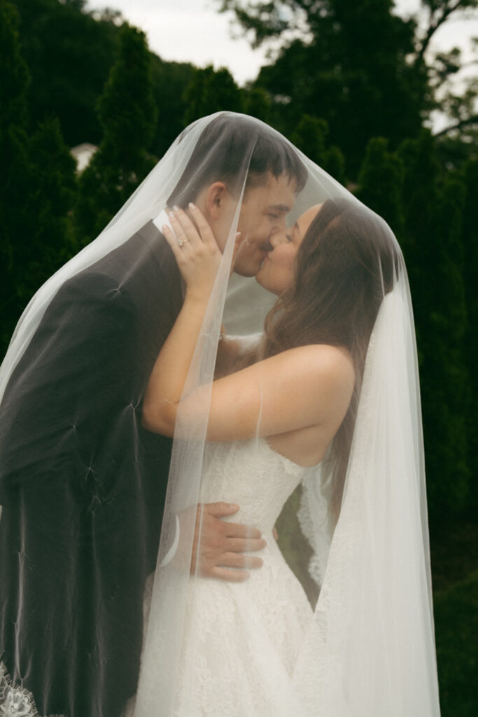 cute picture of the newlyweds kissing