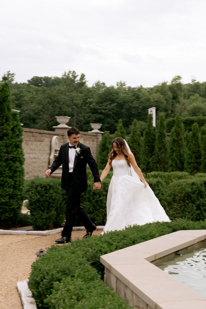 cute portrait of the newlyweds holding hands